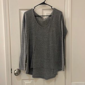 Grey long sleeve women’s top, longer in back